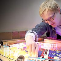 Luke Christensen working on a pinball machine