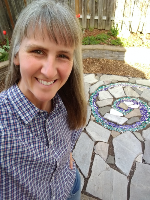 Dr. Lowgren shows off her backyard patio project.