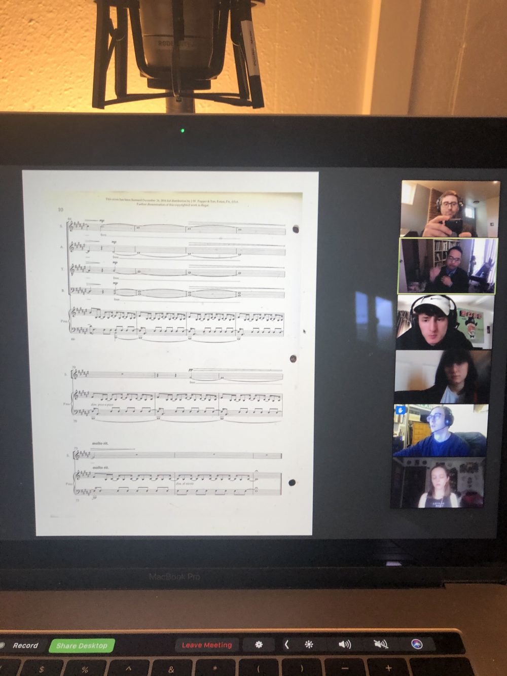screenshot of sheet music and students in a video meeting