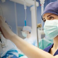 Nurse working with technology in operating room