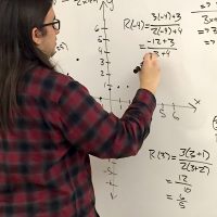 Jimenez tutoring math students at the Southeast Campus Student Learning Center.