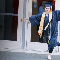 Woman celebrates at commencement.
