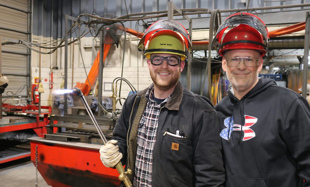 Matt Scott (right) with his son Tanner at Swan Island in 2018.