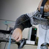 Student using virtual reality (VR) goggles