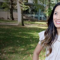 Tunyanit Khuankhruea standing outside in the sun and smiling