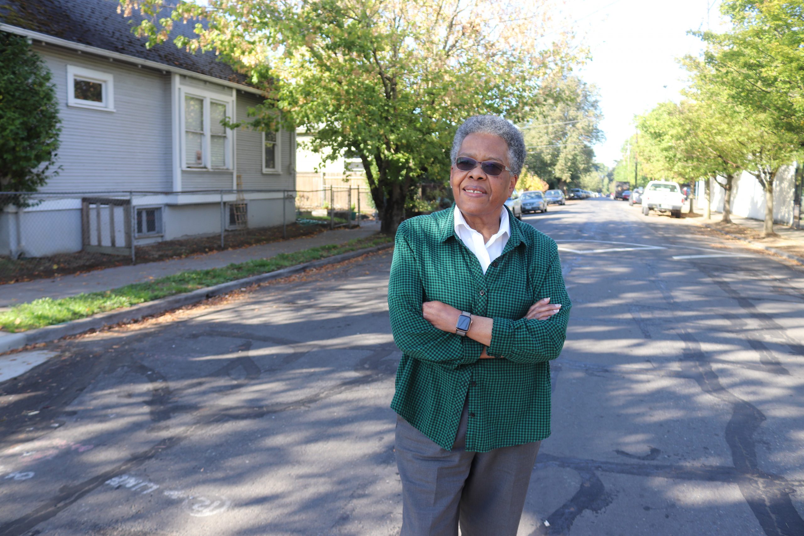 Carmen Sylvester poses in the street where she once walked the beat.