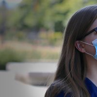 Student Stacey Green outside wearing a mask