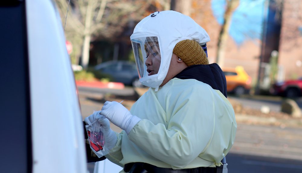 Multnomah County health workers provide COVID-19 testing during a Wednesday clinic at PCC's Cascade Campus.