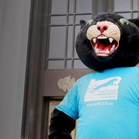 Poppie the Panther standing outside the Capitol Building in Salem