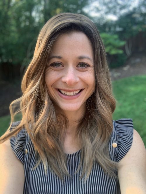 woman with long hair smiling