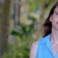 Brita Clothier standing outside smiling into the camera