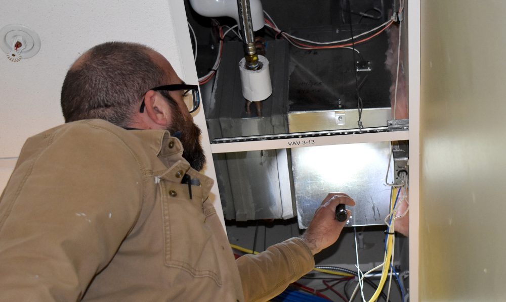 Jimmy Hood inspects HVAC systems.