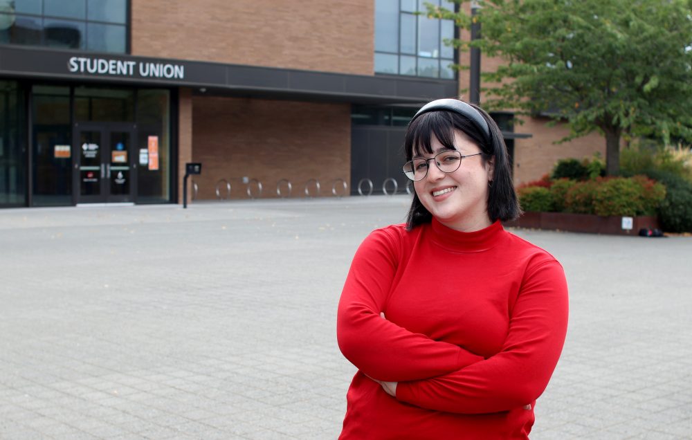 Anya DeCarlo in front of Cascade's Student union.