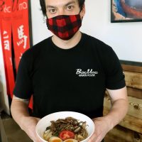 Robert Greenup with a bowl of noodles.