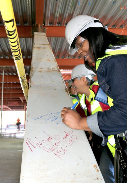 Staff and faculty sign first construction beam at Rock Creek's Building 5.