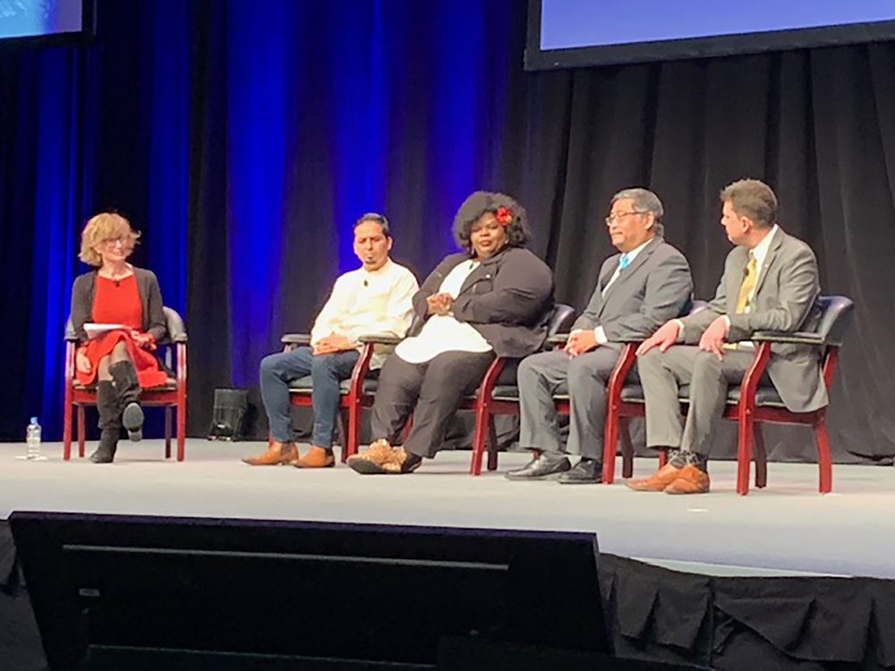 Mark Mitsui discusses education with the panelists at the 19th Annual Oregon Leadership Summit of the Oregon Business Plan.