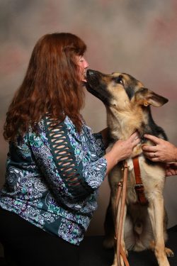 Patricia Kepler with her service dog Gus.