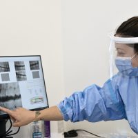 student looks at x-rays