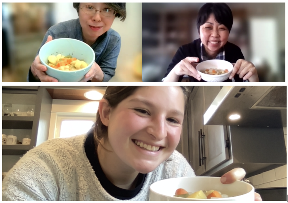 students holding up the meal they created together