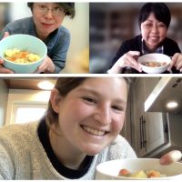 students holding up the meal they created together