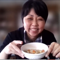 students holding up the meal they created together