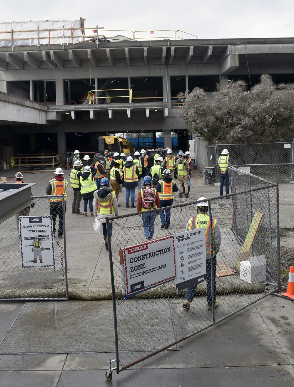 Building Construction Technology students entering the HT project site for a tour