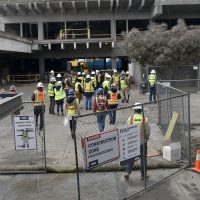 Building Construction Technology students entering the HT project site for a tour