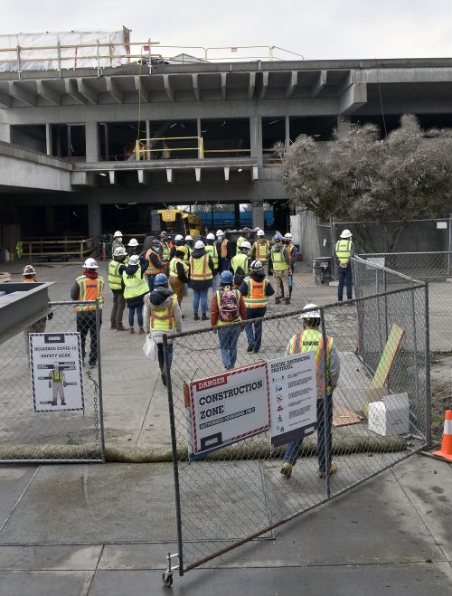 Building Construction Technology students entering the HT project site for a tour