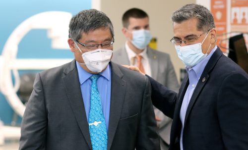PCC President Mark Mitsui and Secrtary Becerra share a light moment in PCC"s new medical imaging lab.