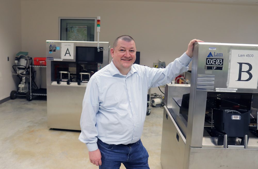 Steven Duggan posing in the microelectronics lab at PCC.