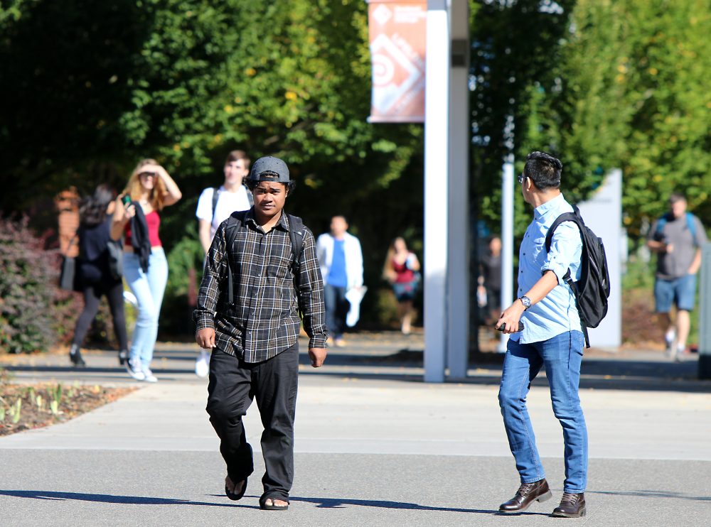 people walking on campus