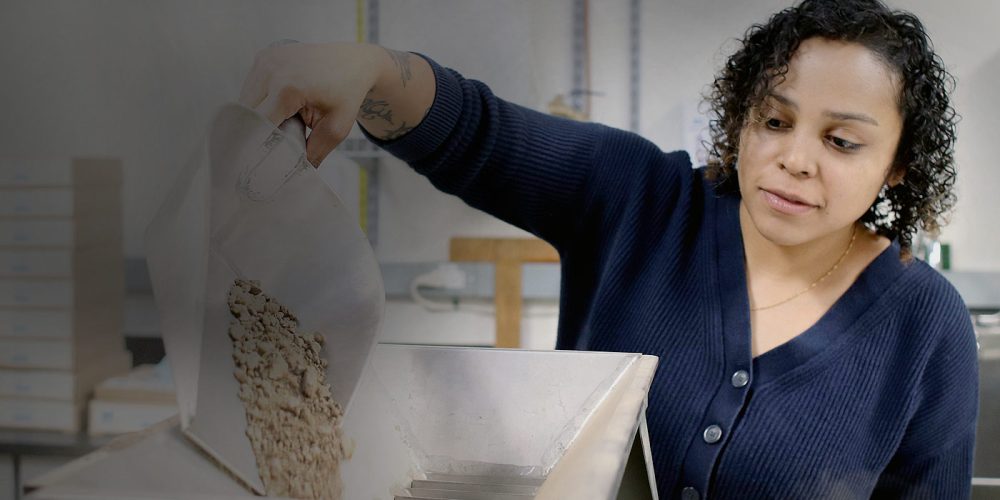 Ellissa Stevenson pouring soil.