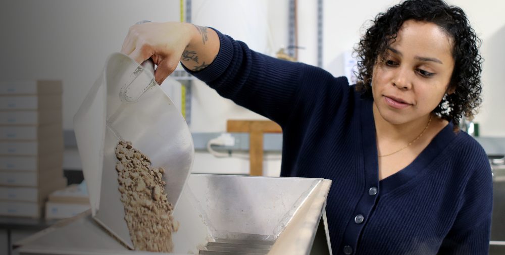 Ellissa Stevenson pouring soil.