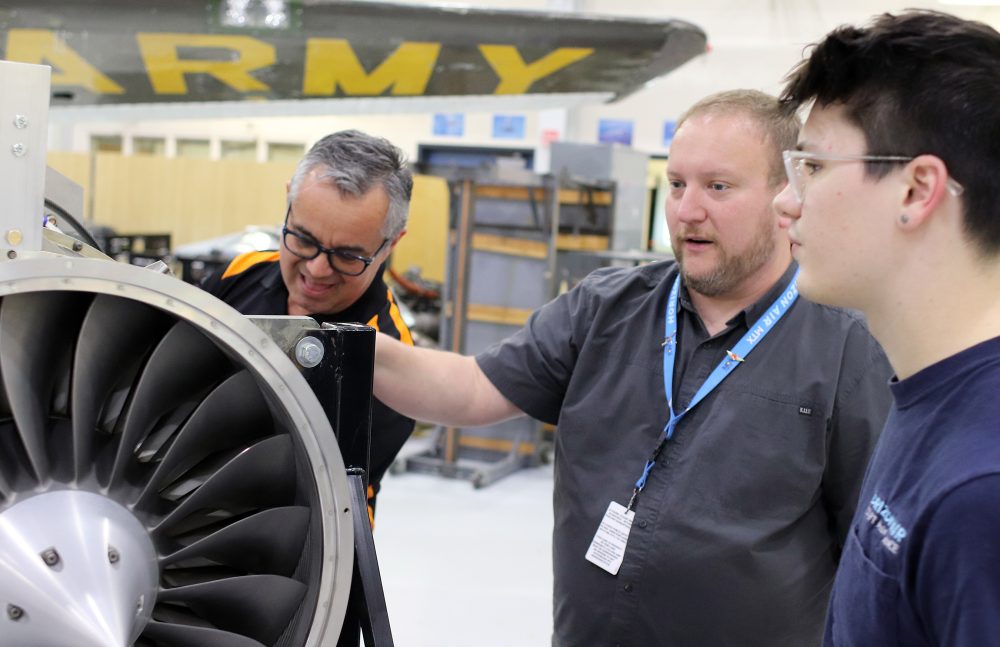 Staff show student plane engine