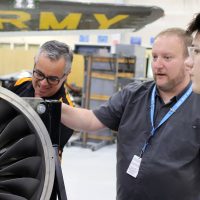 Staff show student plane engine