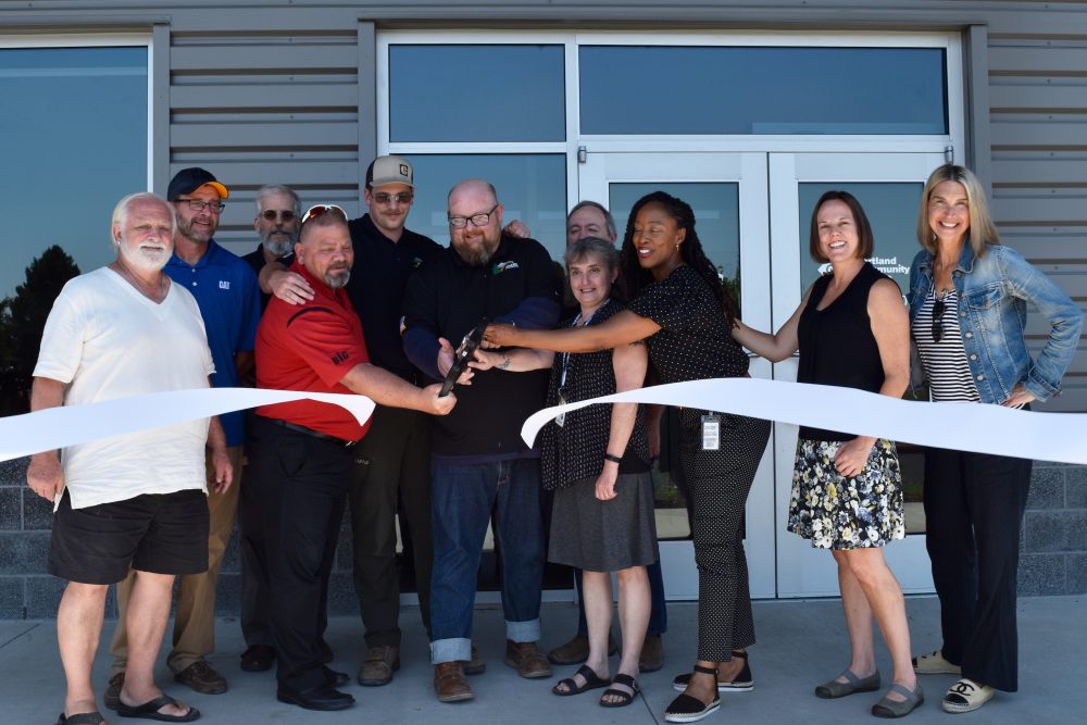 From left, Michael Sonnleitner (PCC board), Sander Torgeson (faculty), Mace Gjerman (Caterpillar), Bobby Vellum (ThinkBIG program manager), Dan Brotherton (PCC alum), Jesse Norconk (ThinkBIG faculty chair), Kevin Comstock (faculty), Karen Sanders (dean), PCC President Dr. Adrien Bennings, Kristi Wilson (PCC board) and Laurie Cremona Wagner (PCC board vice chair).