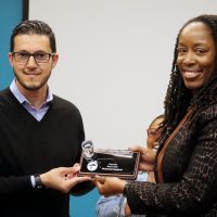 Dr. Benninsg hands Mohamed his award