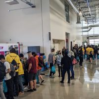 students visiting with industry representatives inside manufacturing training center