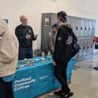 PCC welding instructor talks to a student