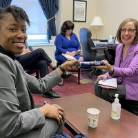 Andrea Salinas receives one of Dr. Bennings' patented track batons.