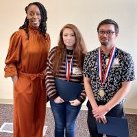 Dr. B with Emily Swenson and Joshua Webb.