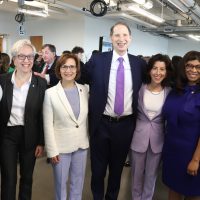 U.S. Secretary of Commerce Gina Raimondo (center in purple) with, from left, PCC President Adrien Bennings, Oregon Governor Tina Kotek, Congresswoman Suzanne Bonamici, U.S. Senator Ron Wyden, State Rep. Janelle Bynum and State Sen. Janeen Sollman.