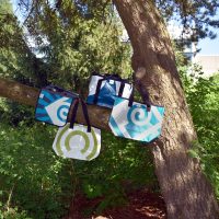 Two hundred pounds of vinyl banners were saved from the landfill by making these multipurpose bags.