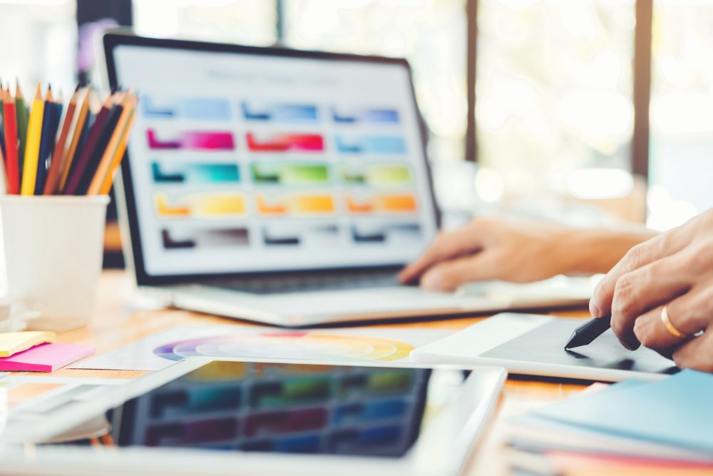 Graphic designer Brainstorming drawing on graphics tablet at workplace