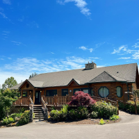 Exterior image of lodge style Carolyn Moore Writers House in Tigard, Ore.