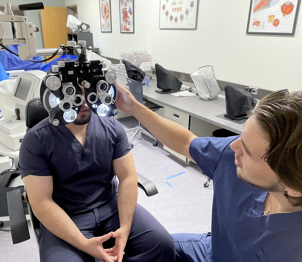 Vladislav Kirilov in lab checking student's vision