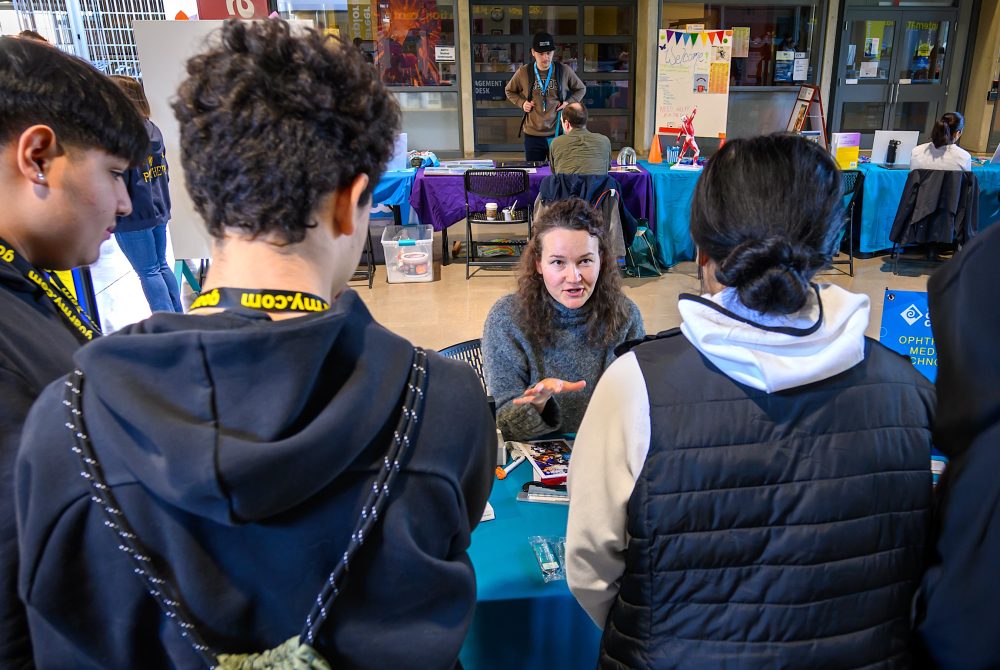 Table volunteer provides guidance.