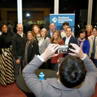 Man taking photo of group