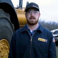 Ben Brown in front of tractor