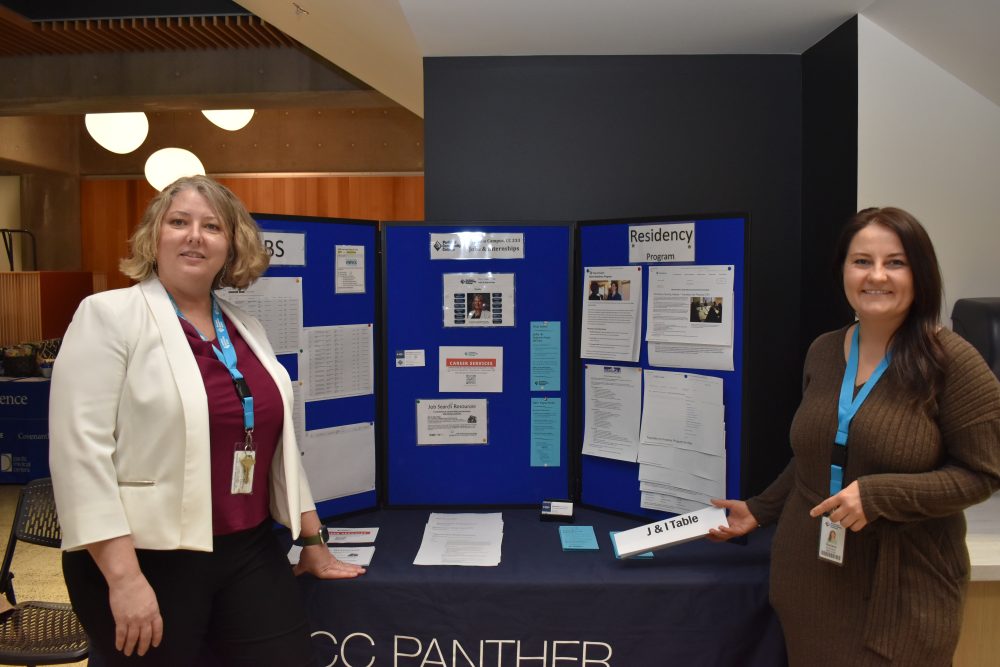 Two women promote career opportinities to nurses.